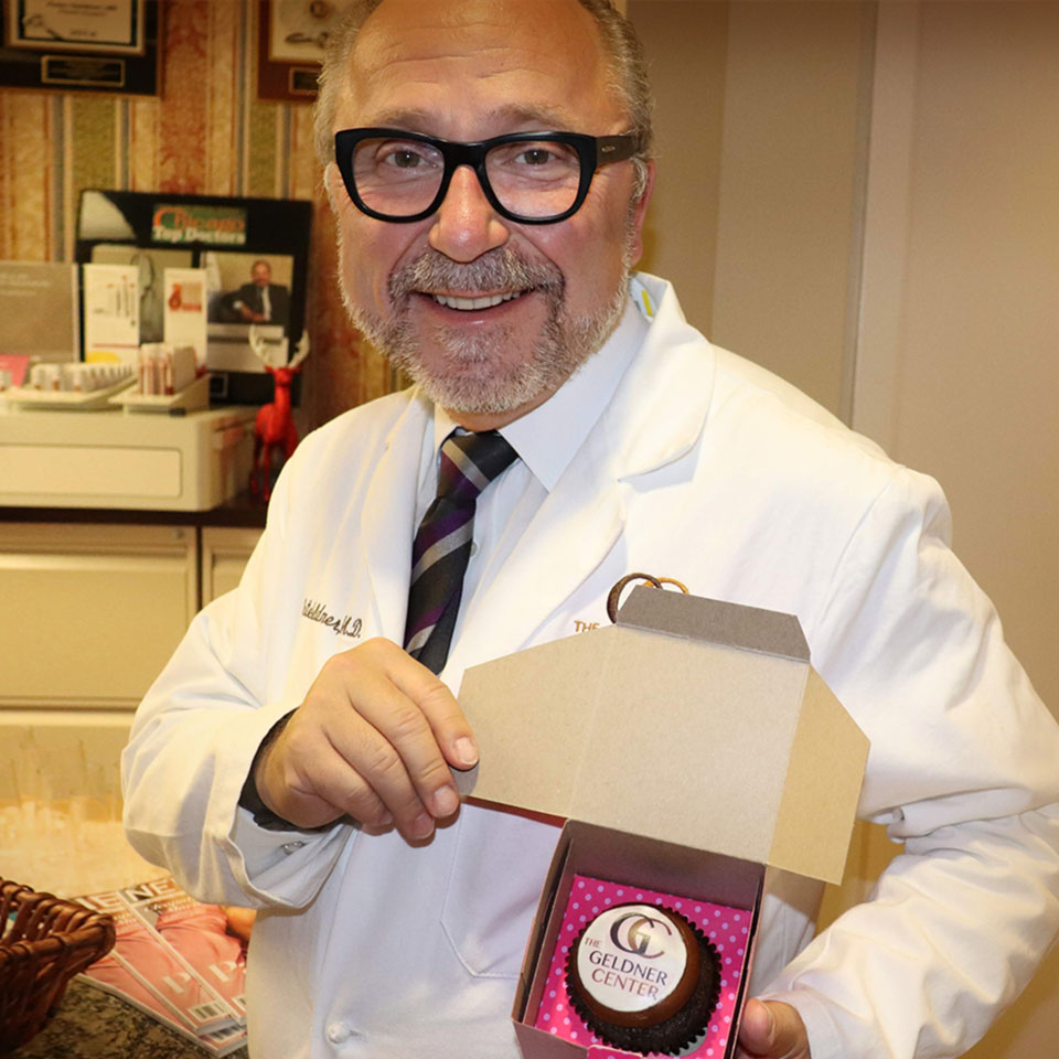 Dr. Geldner with cupcake from our staff