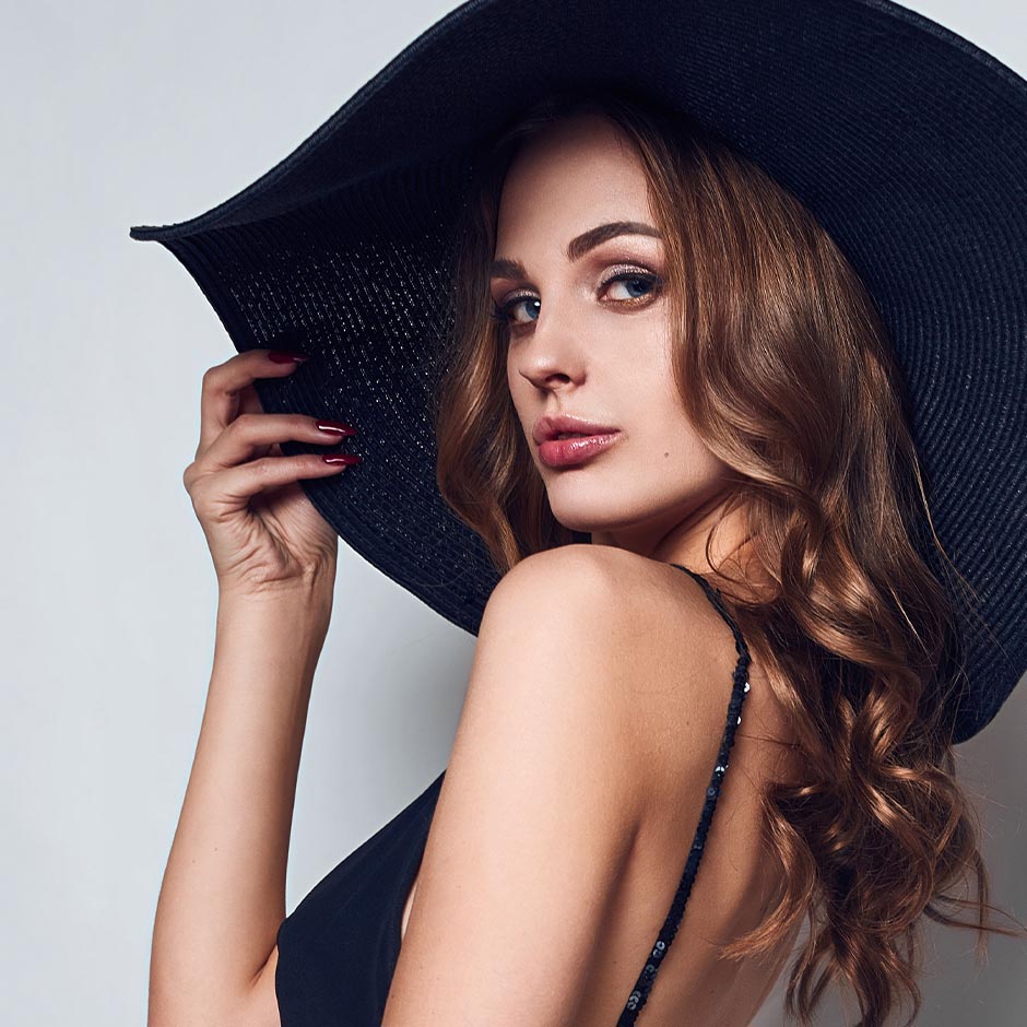 woman in a black hat