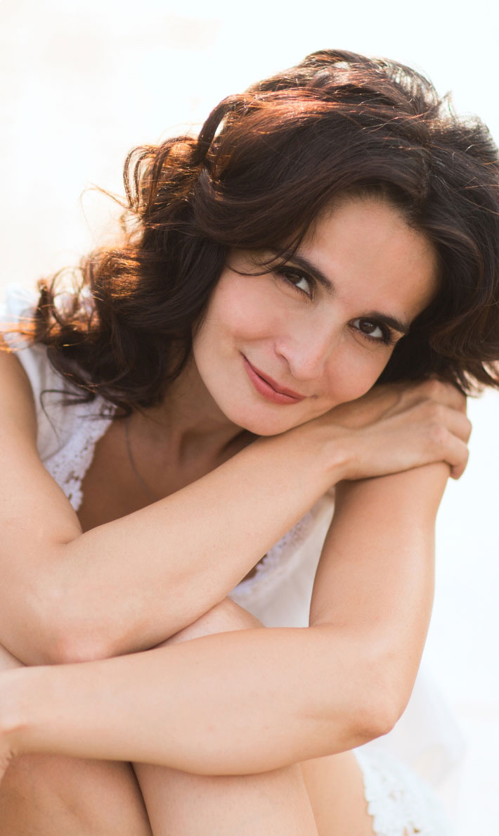 woman with dark hair smiliing