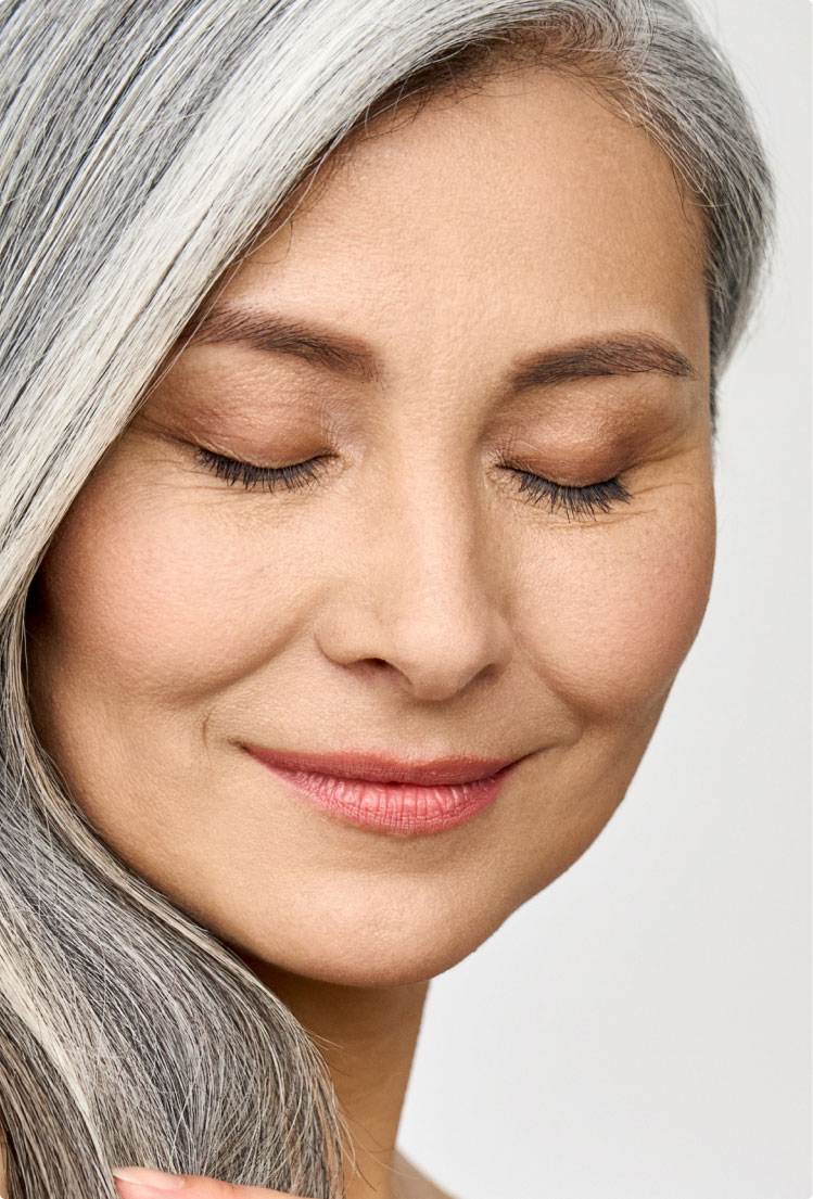 woman with silver gray hair smiling