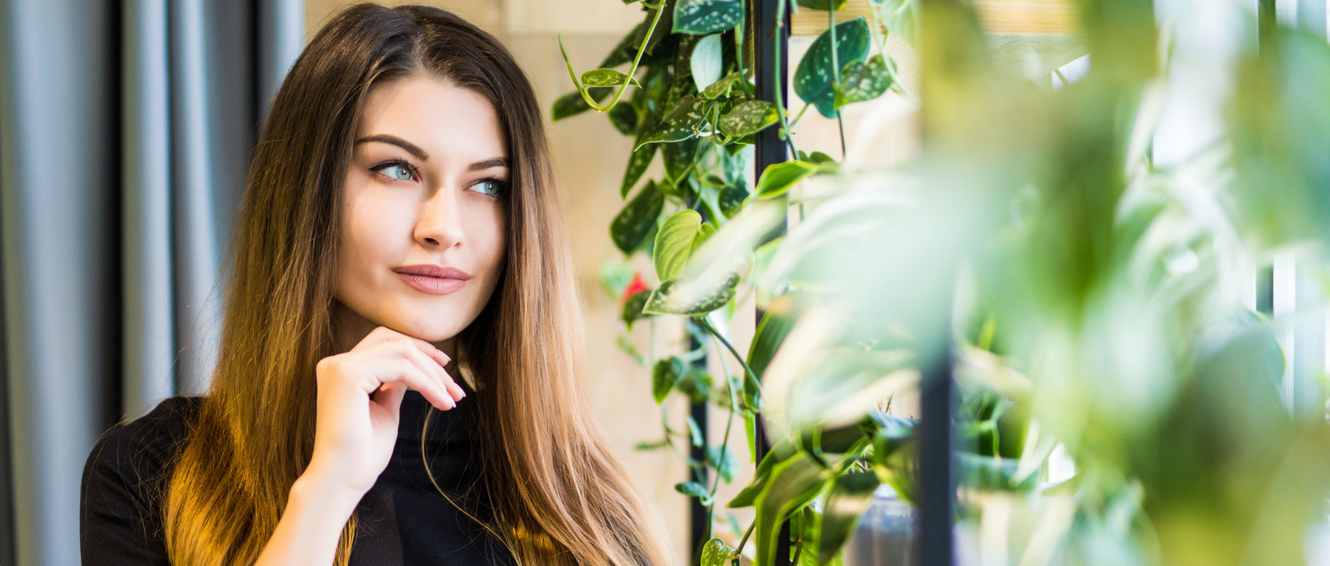 chicago woman looking out a window contemplating rhinoplasty chicago woman looking out a window contemplating rhinoplasty